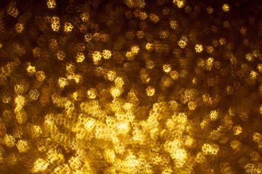 Noel arkaplanı. Bokeh odaklı ışıklar ve yıldızlarla şenlikli soyut arkaplan.