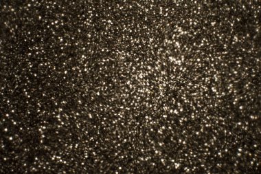 Noel arkaplanı. Bokeh odaklı ışıklar ve yıldızlarla şenlikli soyut arkaplan.