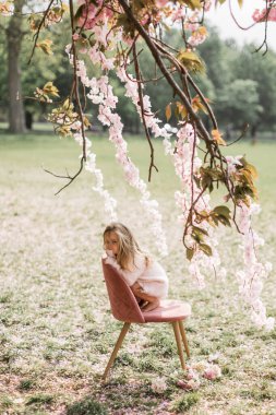 Portrait of a beautiful young long-haired girl in dress. Adorabl