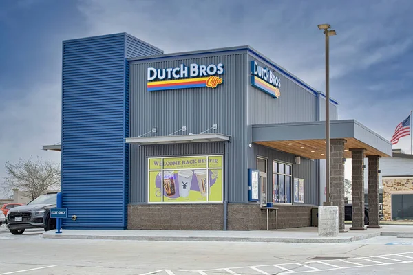 stock image Houston, Texas USA 02-26-2023: Dutch Bros Coffee business exterior and drive-thru in Houston, TX. American coffee and beverage chain store, founded in 1992.