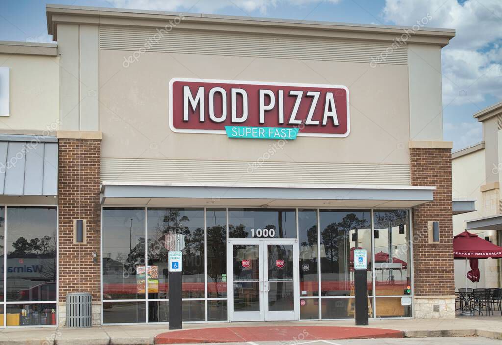 Houston, Texas USA 02-26-2023: Mod Pizza storefront in Houston, TX with outdoor seating area. Fast casual restaurant chain established in 2008.