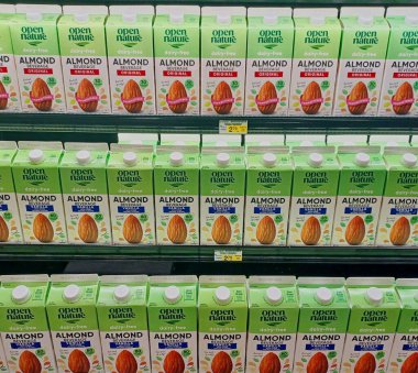 Houston, Texas USA 03-03-2024: Open Nature Almond Beverage cartons displayed on supermarket shelf, plant-based milk substitute. clipart