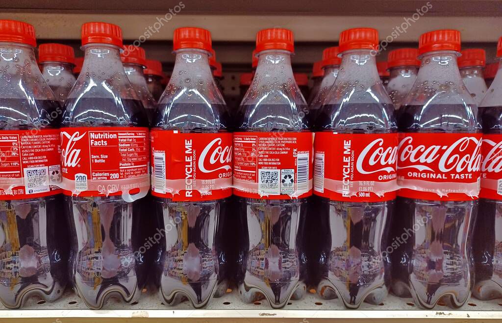 Houston, Texas USA 05-12-2024: Plastic Coca Cola drink bottles on supermarket shelf.