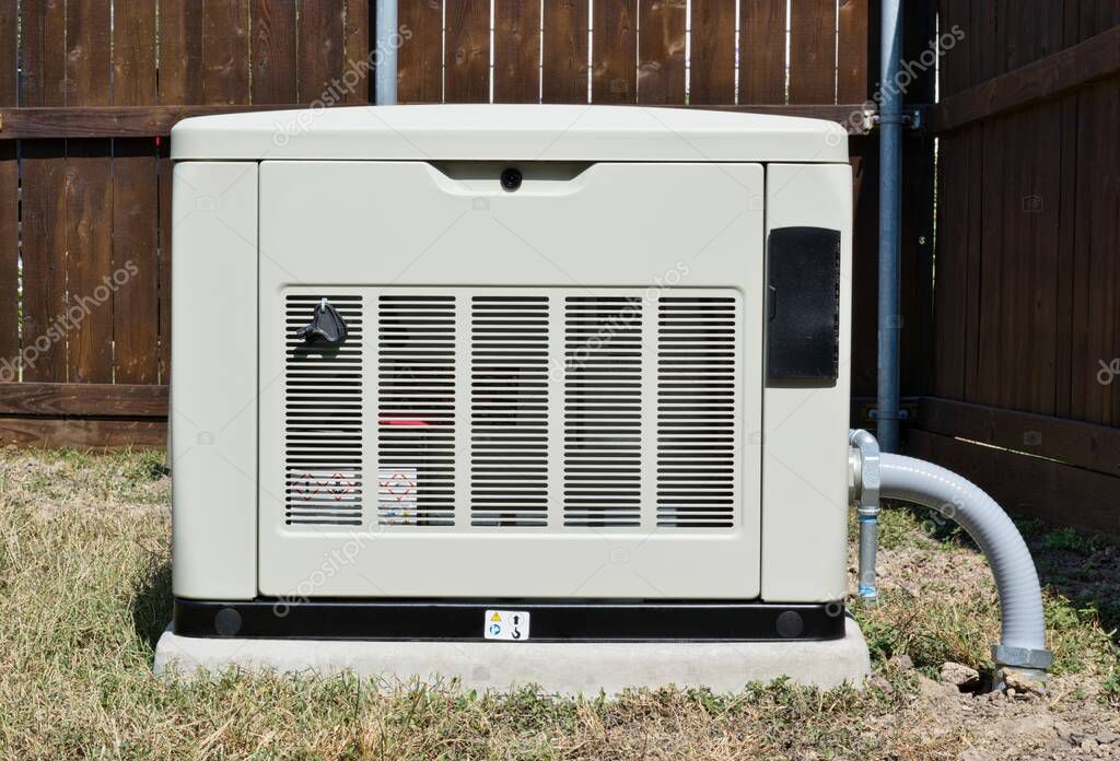 Standby home generator set in residential backyard, emergency backup power supply electricity generation.