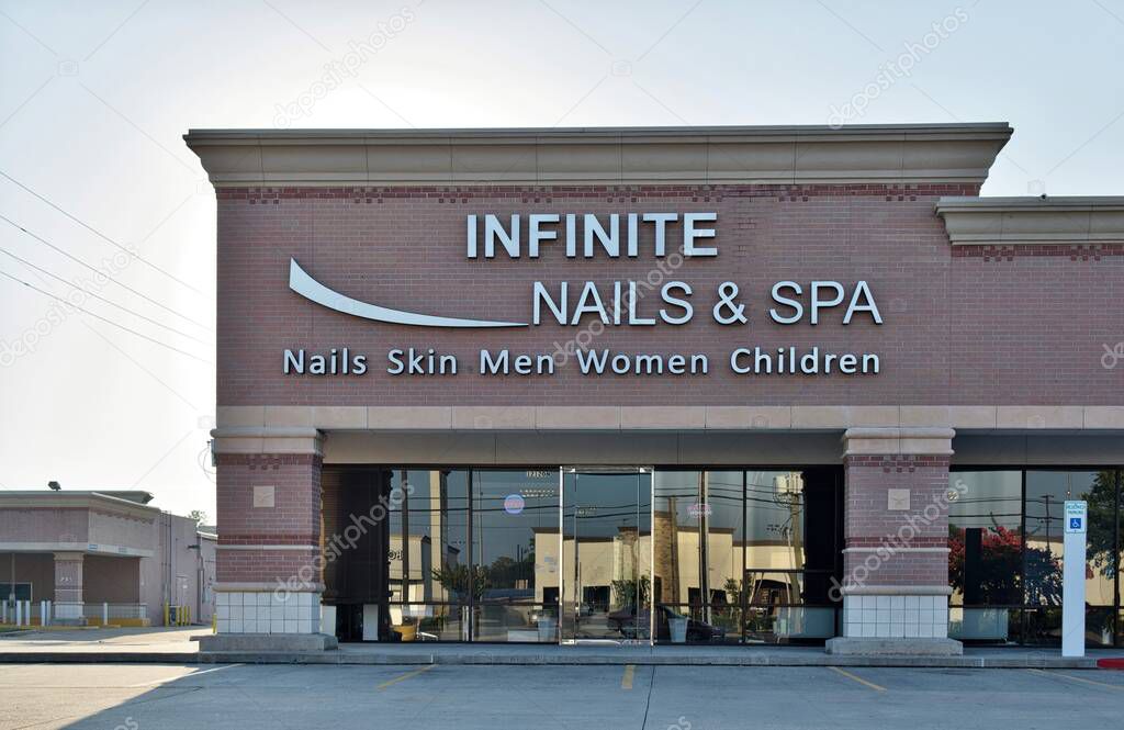 Houston, Texas USA 08-11-2024: Infinite Nails and Spa business exterior storefront.
