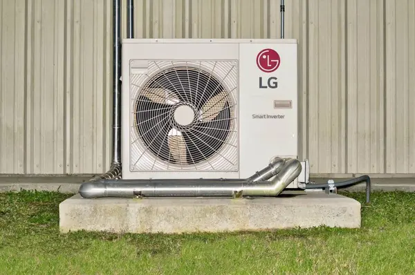 Houston, Texas USA 02-07-2025: LG brand Smart Inverter ductless air conditioning system commercial building exterior slab.