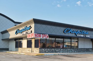Houston, Texas USA 08-03-2025: Chupitos seafood and tacos restaurant storefront local diner.