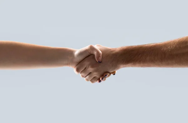 Friendly handshake, friends greeting, teamwork, friendship woman. Two hands, helping arm of a friend, teamwork. Closeup. Helping hand outstretched, isolated arm, salvation girl. Close up help hand .