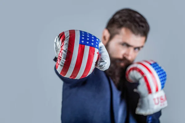 Businessman in america boxing gloves. Businessman with boxing gloves. Man in suit and american boxings gloves, business winner. Boxing man USA. Businessman in Boxing gloves. Ready to business battle.