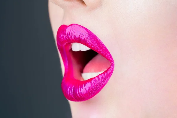 Plump sexy full lips. Pink lipstick. Perfect natural lip makeup. Close-up beautiful lips. Sexy plump lips nude lipstick. Close-up perfect natural lip makeup beautiful female mouth.