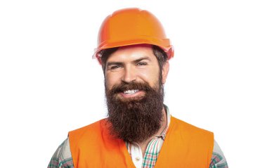 Builder in hard hat, foreman or repairman in the helmet. Bearded man worker with beard in building helmet or hard hat. Portrait of a builder smiling. Man builders, industry.