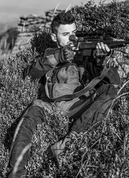 Hunt hunting rifle. Hunter man. Hunting period. The man is on the hunt. Black and white.