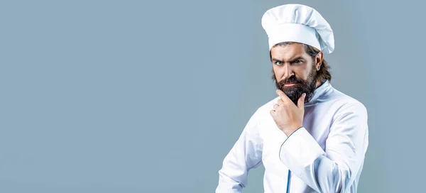 stock image Bearded chef, cooks or baker. Cook hat. Serious cook in white uniform, chef hat. Portrait of a serious chef cook.