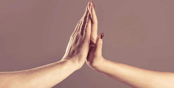 stock image Two hands, male and female. High five concept for success, teamwork, congratulating, celebration. High-five gesture and tenderness of friendship between man and woman.