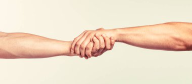 El sıkışma, silah arkadaşlığı. Dostça tokalaşma, dostça selamlaşma, takım çalışması, arkadaşlık. Kurtarma Birimi el hareketlerine yardım ediyor