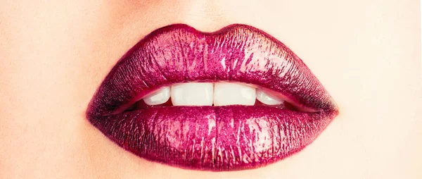 Purple lipstick. Perfect natural lip makeup. Close-up beautiful lips. Sexy plump lips nude lipstick.