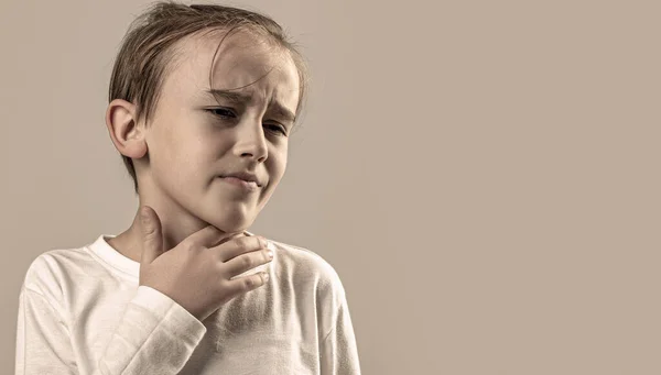 stock image Child has a sore throats. Young boy feels that his throat is pain. Ill little boy with sore throat. Ill child with sore throat. Sore throats in a child.