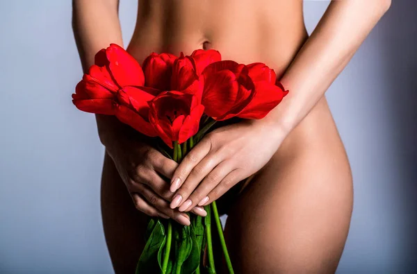 Gynecology, menstruation, concept of woman genital health. Woman flower on white background. Gynecology and underwear, women health. Youth and freshness, purity, flowering.