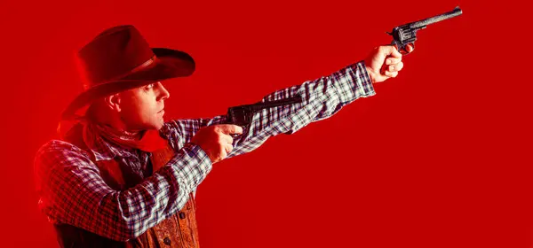 Portrait of farmer or cowboy in hat. Portrait of man wearing cowboy hat, gun. Portrait of a cowboy. West, guns. Portrait of a cowboy.