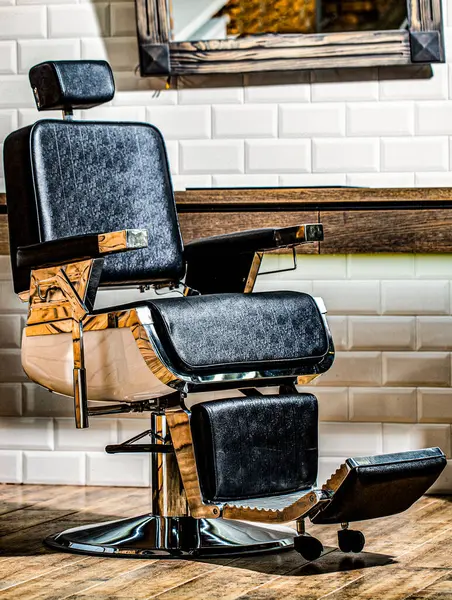 Stylish barber chair. Barbershop theme. Professional hairstylist in barbershop interior. Barber shop chair. Barbershop armchair, modern hairdresser and hair salon, barber shop for men.