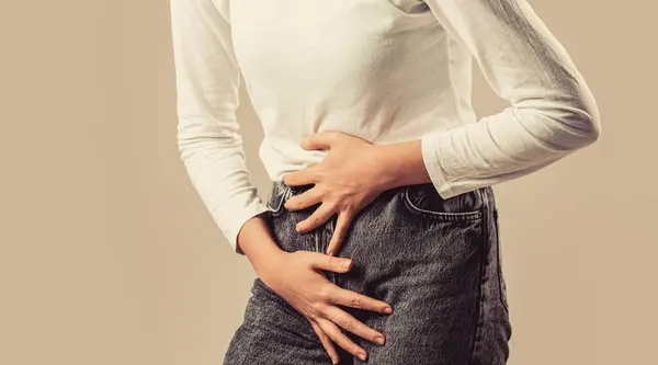 stock image Close up of a woman with hands holding her crotch. Woman Hands Holding Her Crotch. Sick woman hands holding pressing her crotch lower abdomen.