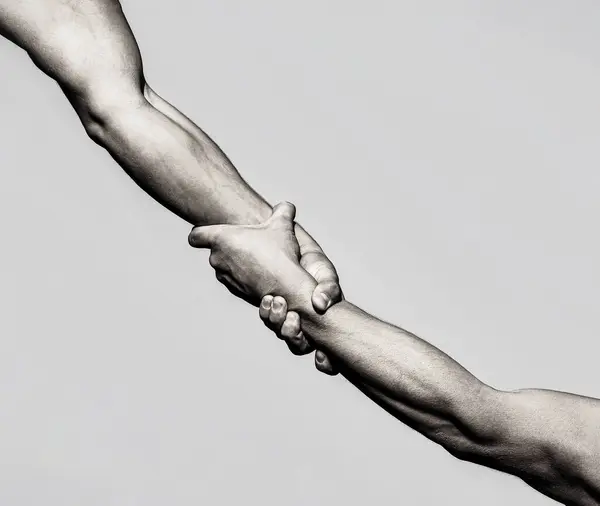 Helping hand concept and international day of peace, support. Closeup. Helping hand outstretched, isolated arm, salvation. Black and white.