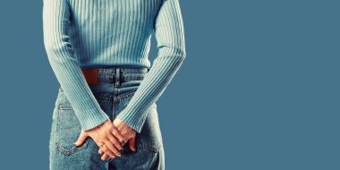 Anus. Woman hand holding her bottom because having abdominal pain and hemorrhoids.
