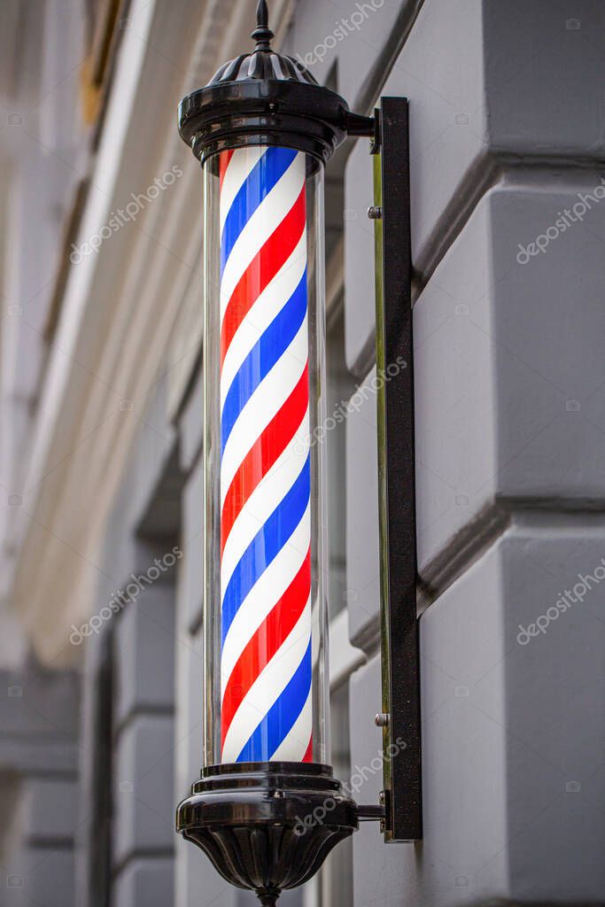 Classic barber logo. Barber shop pole. Logo of the barbershop, symbol. Barbershop pole, retro. Old fashioned vintage barber shop pole.