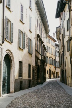 Color image of a narrow empty street in an old town.