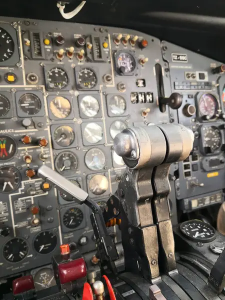 Close up shot of the control panel in a plane cockpit.