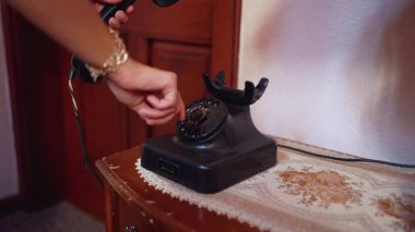 Woman Dialing Vintage Telephone in Retro Room. High quality 4k footage