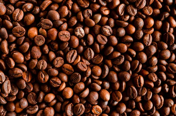 stock image Dark roast coffee beans background, top view. Coffee bean background