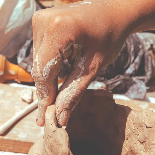 Potter\'s hands close-up. Clay products. Fine hand motor skills