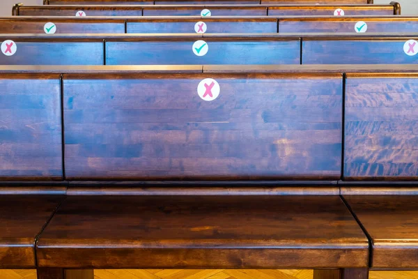 Empty rows of wooden bench in the courtroom or church. Nobody