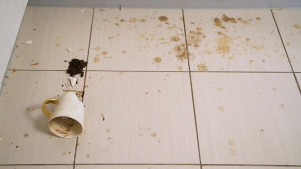 Broken Tea Cup Laying Kitchen Floor Smashed Coffee Mug Coffee — Stockvideo
