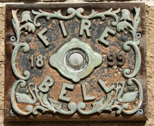 stock image Closeup of an antique fire bell on the wall of an old fire station