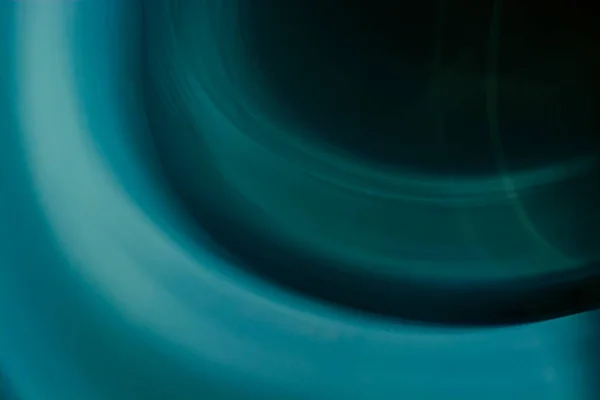 Abstract background of circles and waves in blue, turquoise and dark colors with a gradient. Backdrop