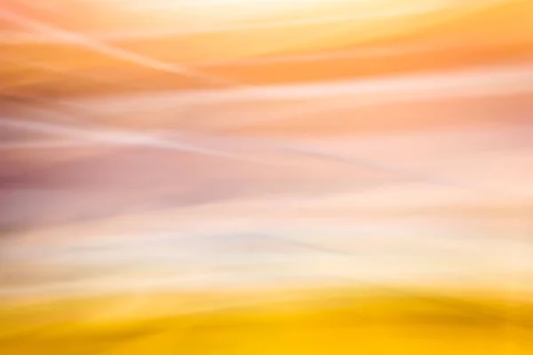 アブストラクトモーションブラー効果 黄色のオレンジのトーンでカラフルな背景 波状の背景がぼやけています バックアップ — ストック写真