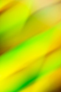 Pürüzsüz çizgileri ve sarı, yeşil ve turuncu renkleri olan soyut arkaplan pankartı. Hologram konsepti. Arkaplan