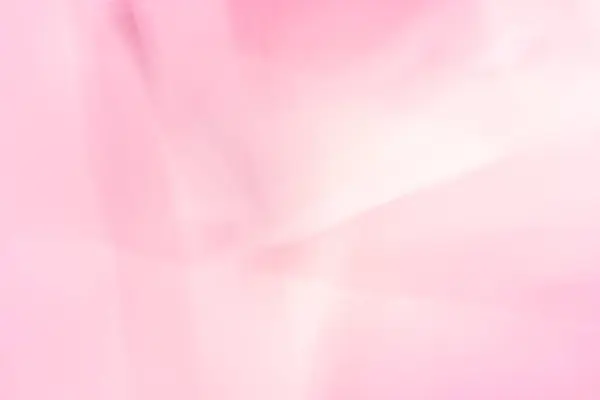 Bulanık pembe ve beyaz gölgeli soyut bir görüntü. Özel efektli bir fotoğraf ya da grafiksel olarak işlenmiş bir arka plan olabilir. Renk şeması pembe tonlar arasındaki yumuşak ve nazik geçişlerle karakterize edilir..