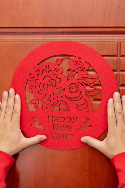 Man Sticking Chinese New Year Rabbit Paper Cut Decoration Door — Stock Photo, Image