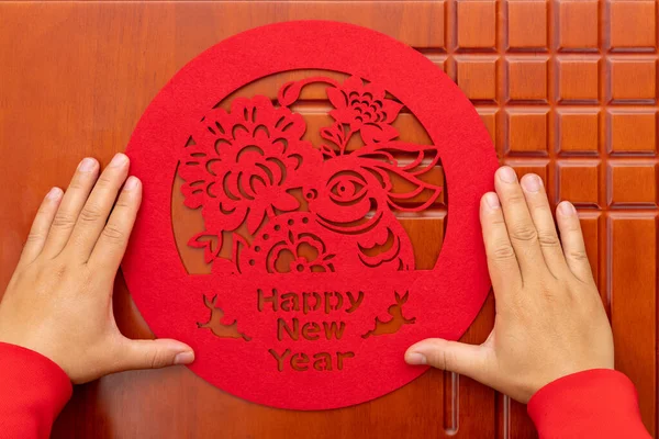 Man Sticking Chinese New Year Rabbit Paper Cut Decoration Door — Stock Photo, Image