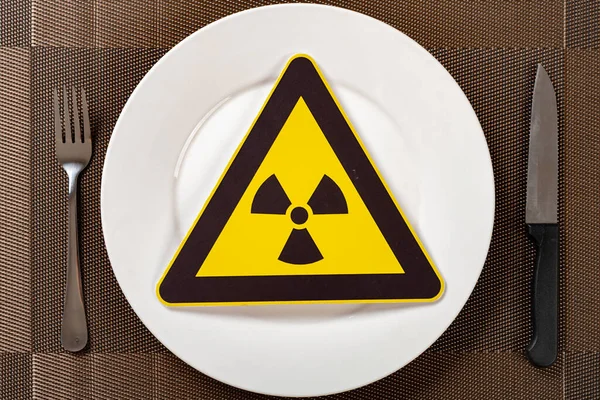 nuclear radiation warning sign on a dish concept of unsafe food
