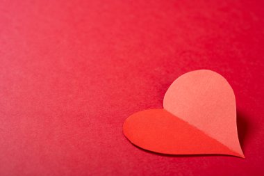 a heart on a red background with copy space