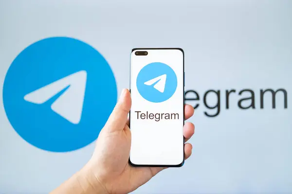 Zhongshan China July 2023 Hand Holding Mobile Telegram Logo Horizontal Stock Image