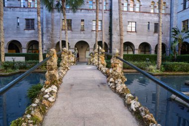 St. Augustine, Florida - December 28, 2022: Courtyard at the Lightner Museum in the downtown historic district, with palm trees and a koi pond