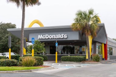 Brunswick, Georgia - January 1, 2023: McDonalds sign with large golden arches, for the fast food chain restaurant