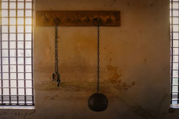 Ball and chain, and shackle hanging on a wall. Old jail in St. Augustine Florida