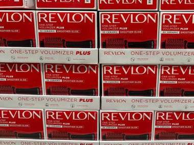 Maple Grove, Minnesota - May 1, 2023: Revlon One-Step Volumizer Plus Hair dryer brush tool on display for sale at a Costco Warehouse store clipart