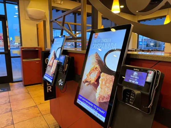 stock image Page, Arizona - March 8, 2024: A tablet kiosk for customers to place their order, contactless ordering at a Taco Bell fast food restaurant
